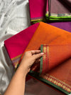 Subtle Weaves – Orange Kanchi Cotton Saree with Small Border