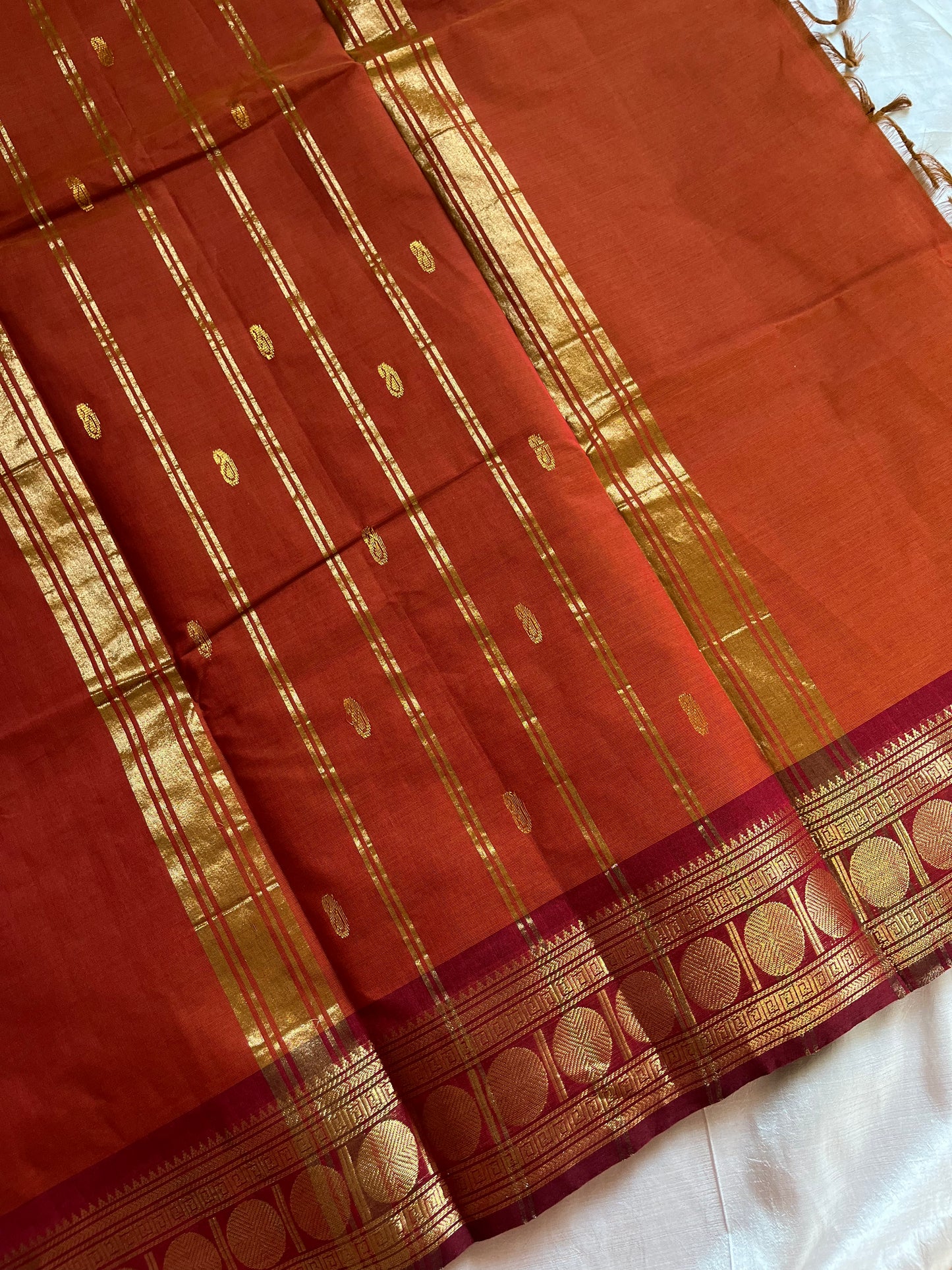 Rust orange Kanchi cotton saree with maroon vintage border – handloom drape from House of Thansha.