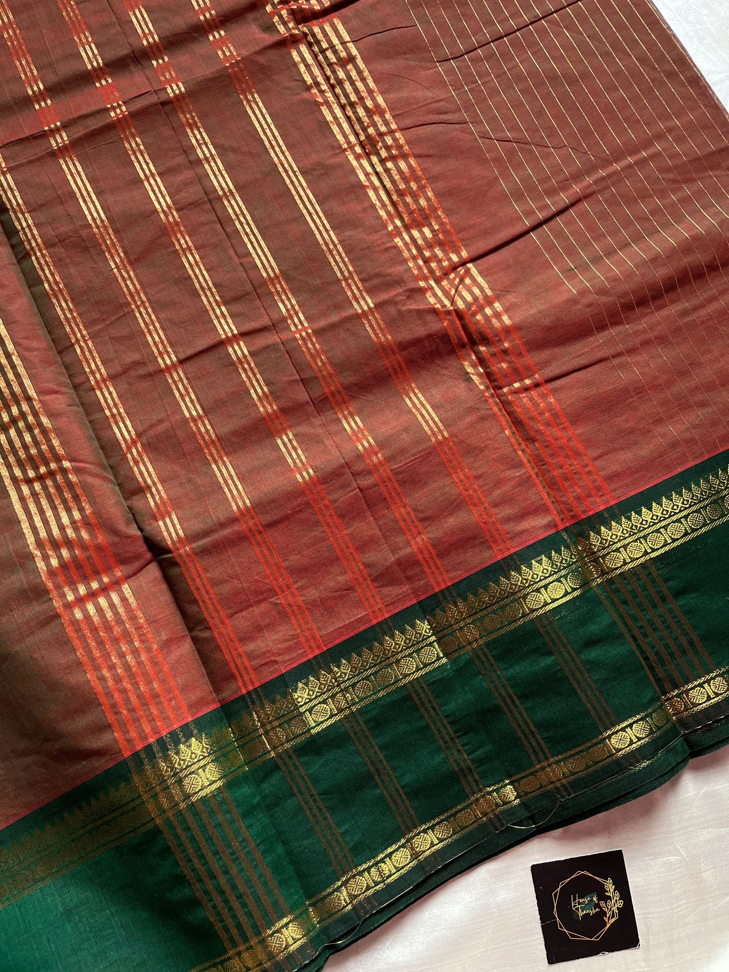 Raw Mango Green Kanchi cotton saree with golden zari stripes and dual green border, vintage handloom festive edition.