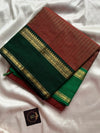 Raw Mango Green Kanchi cotton saree with golden zari stripes and dual green border, vintage handloom festive edition.
