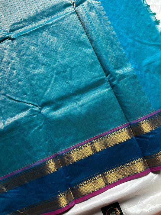 Blue pure Kanchi cotton saree featuring golden zari checks and a grand zari pallu.