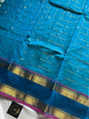 Blue pure Kanchi cotton saree featuring golden zari checks and a grand zari pallu.