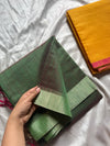 Soft Tissue Edit ā Dark green Plain tissue saree with minimal border