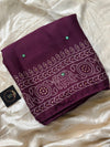 Wine chiffon saree with Bandhani design and all-over mirror work, paired with running blouse