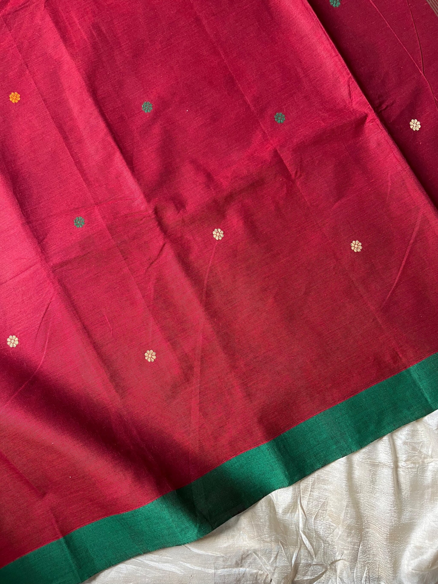 Maroon handloom Kanchi cotton saree with handwoven buttas, subtly woven pallu