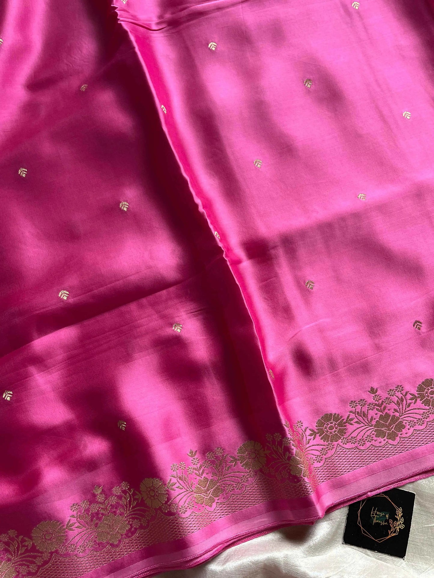 Rose pink Banarasi mashru silk saree with golden zari work and rich pallu.