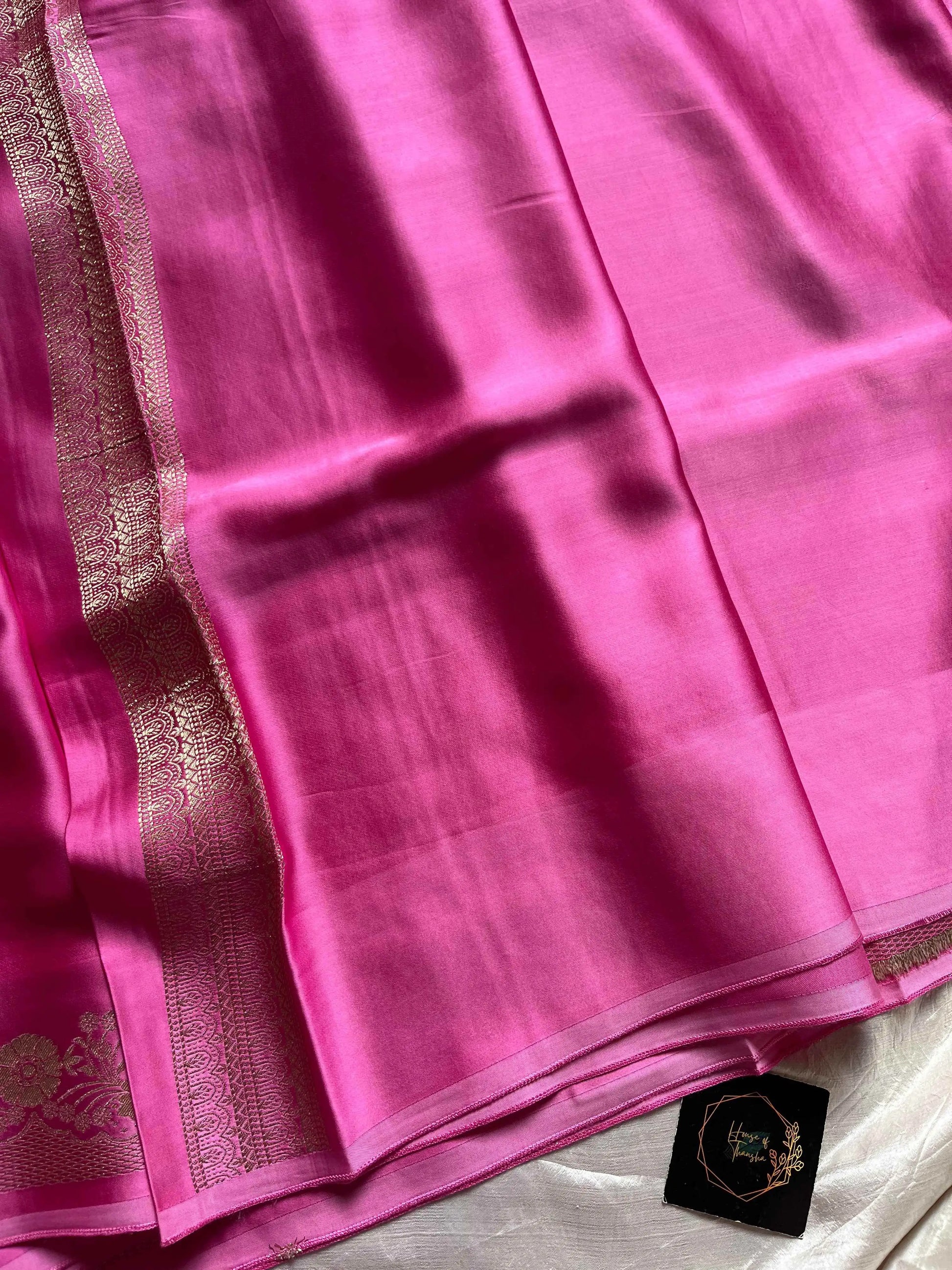 Rose pink Banarasi mashru silk saree with golden zari work and rich pallu.