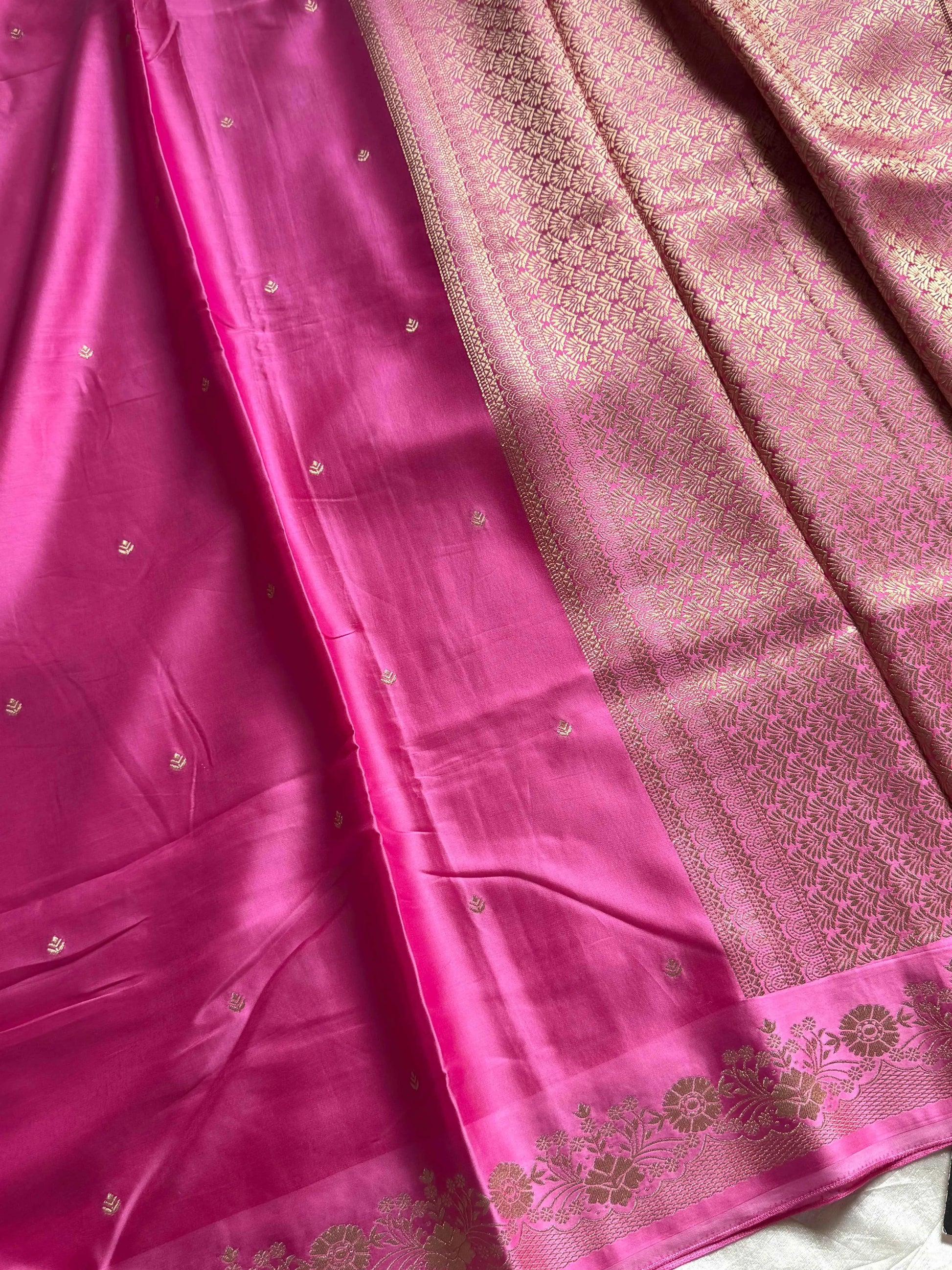 Rose pink Banarasi mashru silk saree with golden zari work and rich pallu.