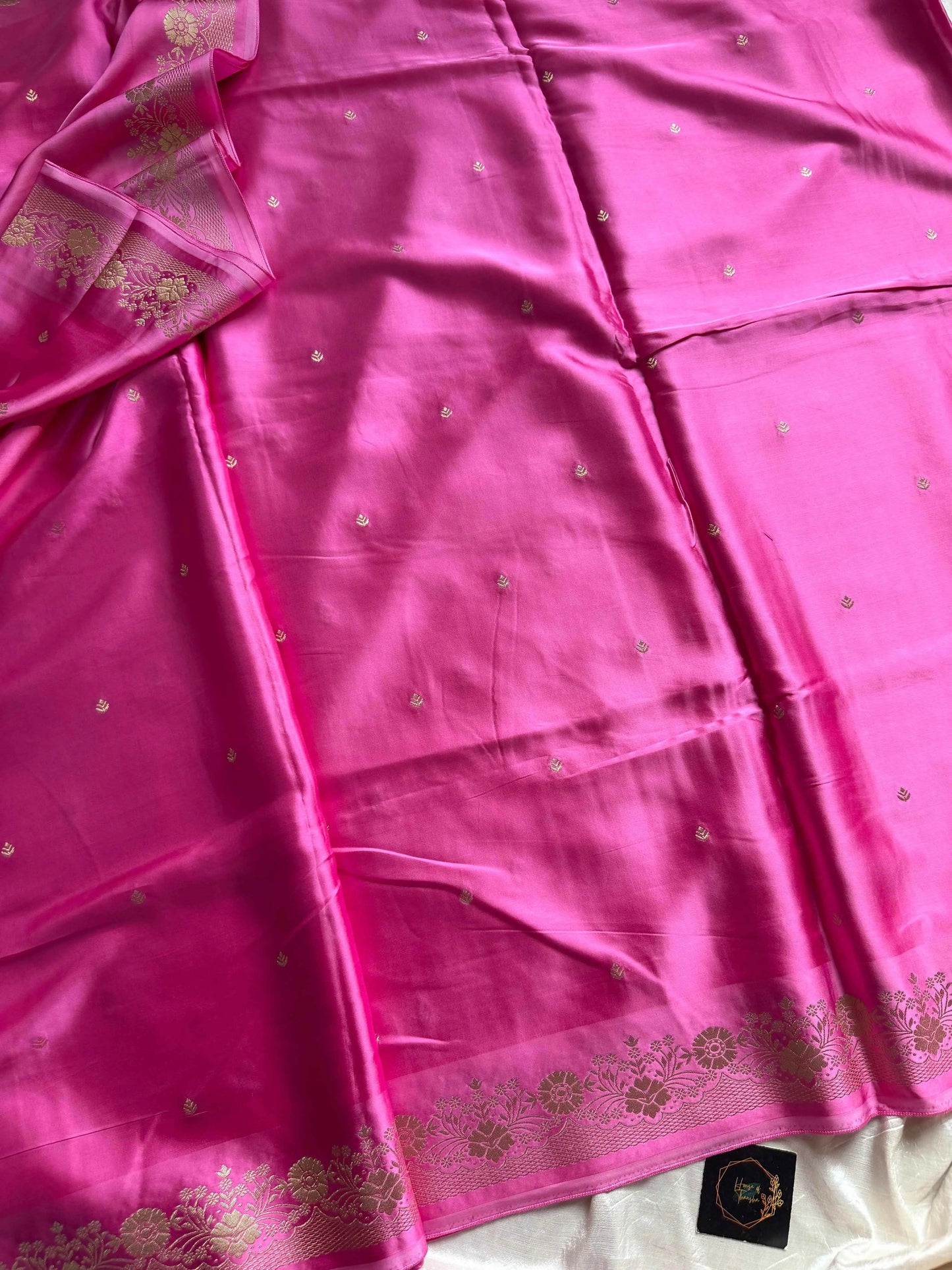 Rose pink Banarasi mashru silk saree with golden zari work and rich pallu.