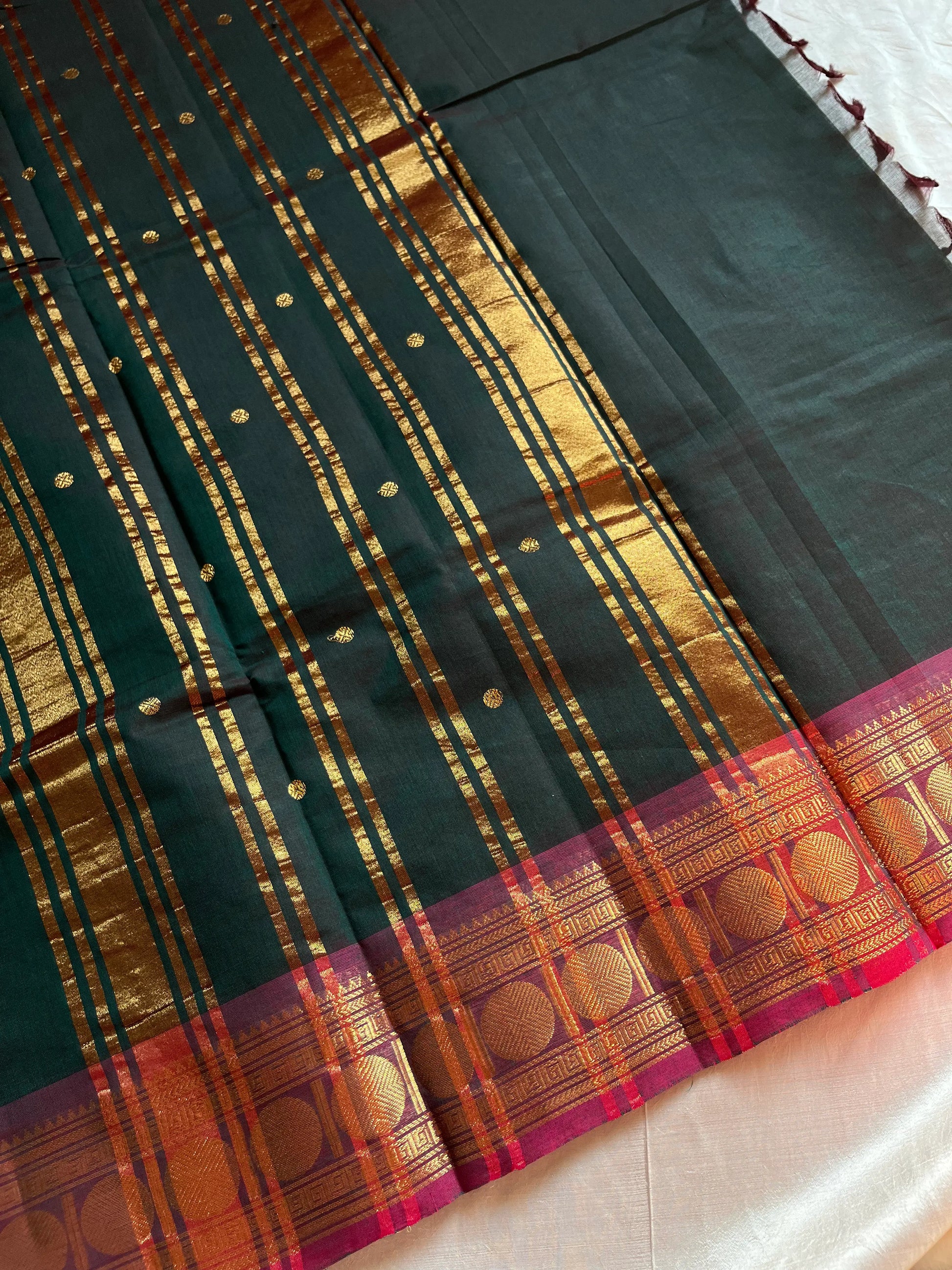 Dark green Kanchi cotton saree with maroon vintage border – handloom drape from House of Thansha.