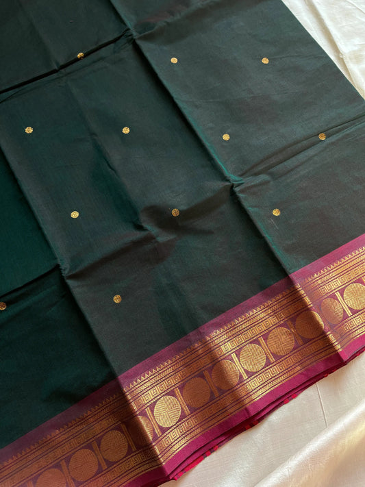 Dark green Kanchi cotton saree with maroon vintage border – handloom drape from House of Thansha.