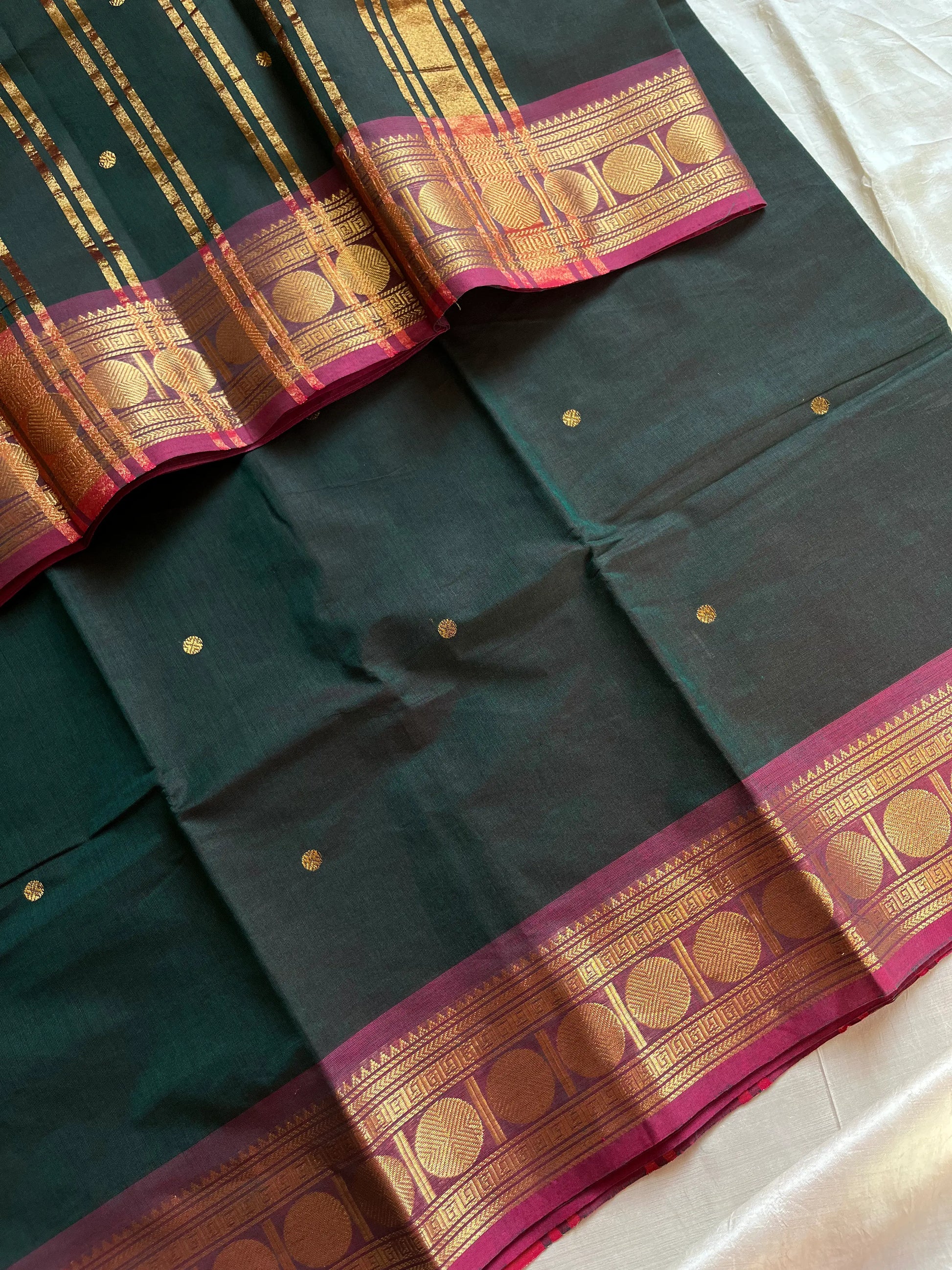 Dark green Kanchi cotton saree with maroon vintage border – handloom drape from House of Thansha.