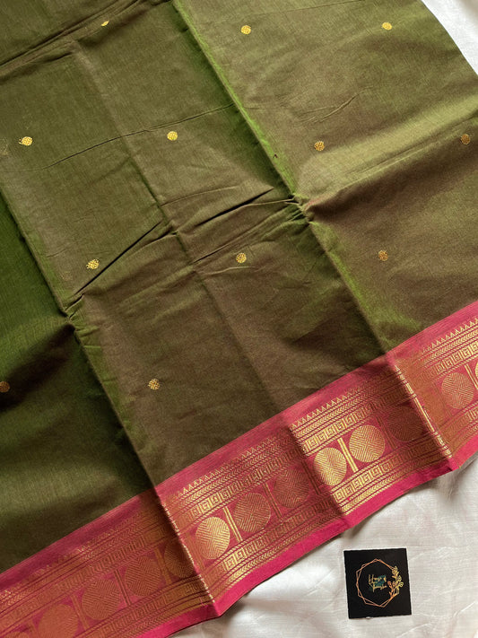 Earthy green Kanchi cotton saree with pink vintage border – handloom drape from House of Thansha.