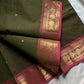 Earthy green Kanchi cotton saree with pink vintage border – handloom drape from House of Thansha.