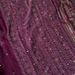 Wine chiffon saree with Bandhani design and all-over mirror work, paired with running blouse