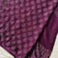 Wine chiffon saree with Bandhani design and all-over mirror work, paired with running blouse