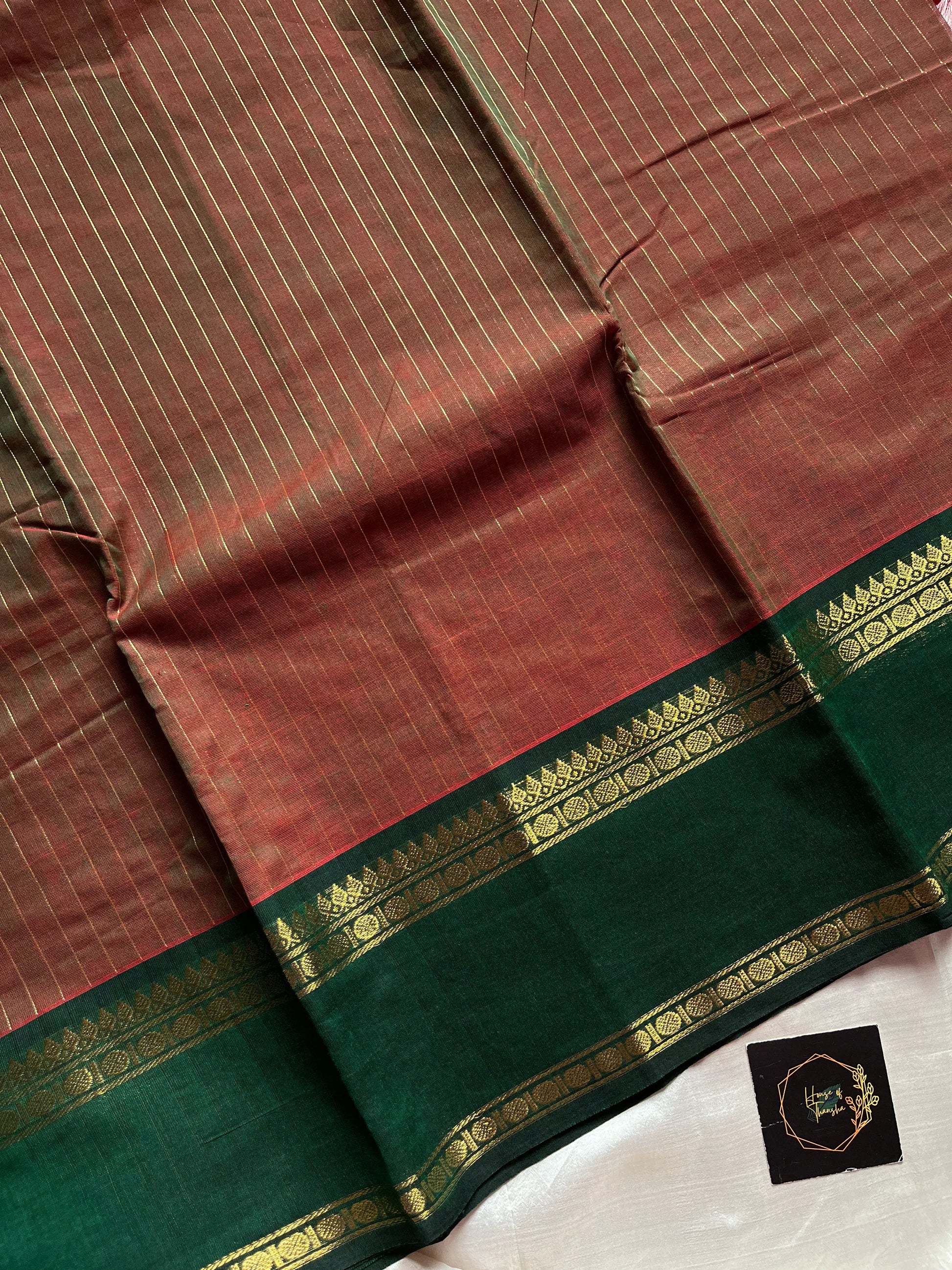 Raw Mango Green Kanchi cotton saree with golden zari stripes and dual green border, vintage handloom festive edition.