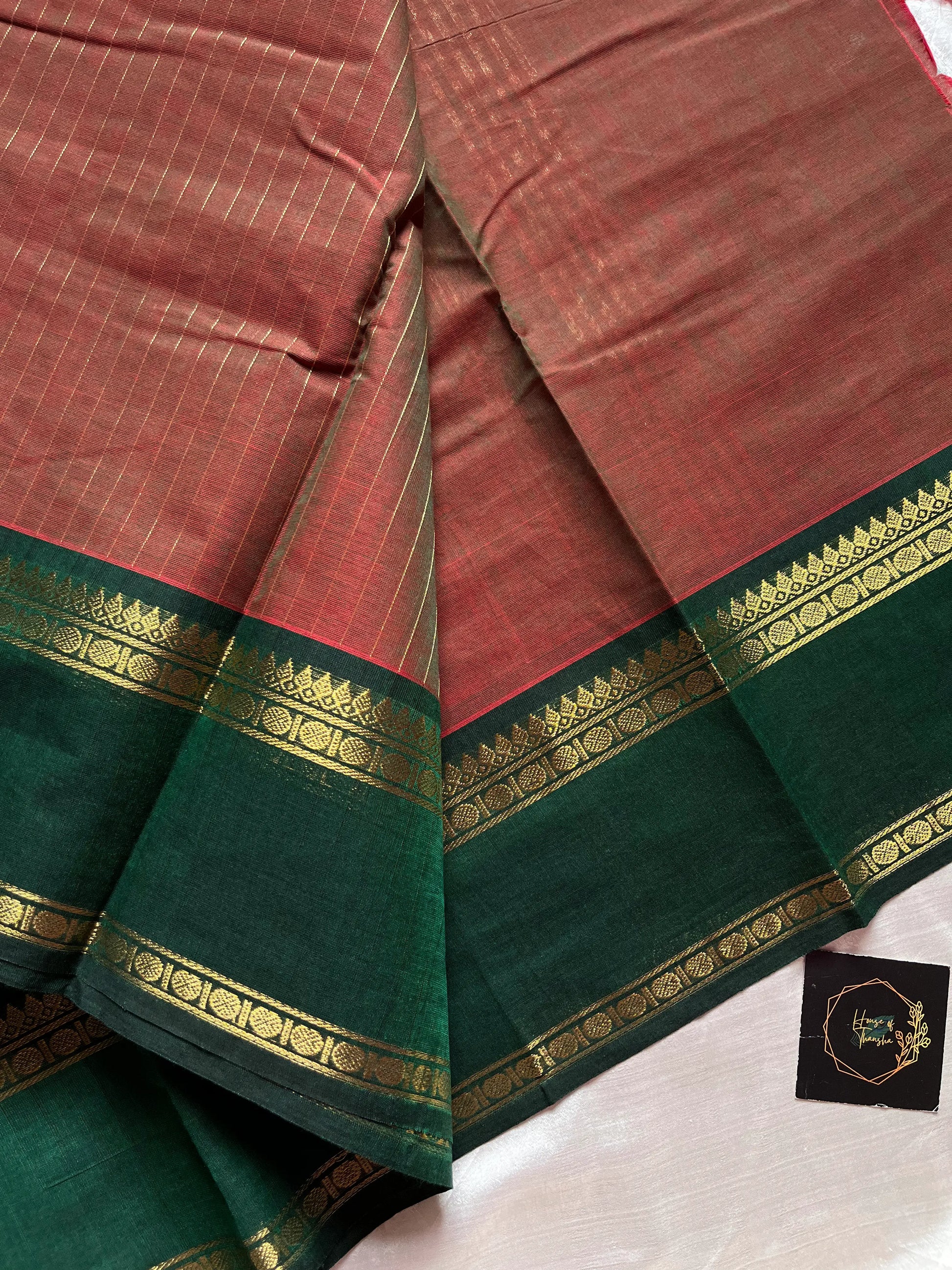 Raw Mango Green Kanchi cotton saree with golden zari stripes and dual green border, vintage handloom festive edition.