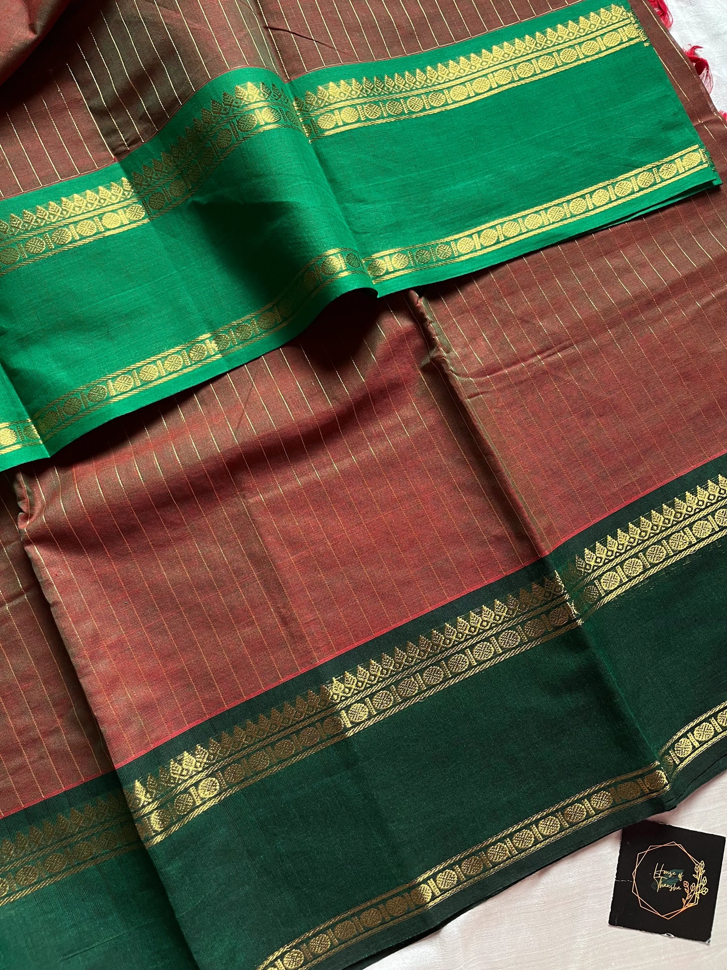 Raw Mango Green Kanchi cotton saree with golden zari stripes and dual green border, vintage handloom festive edition.