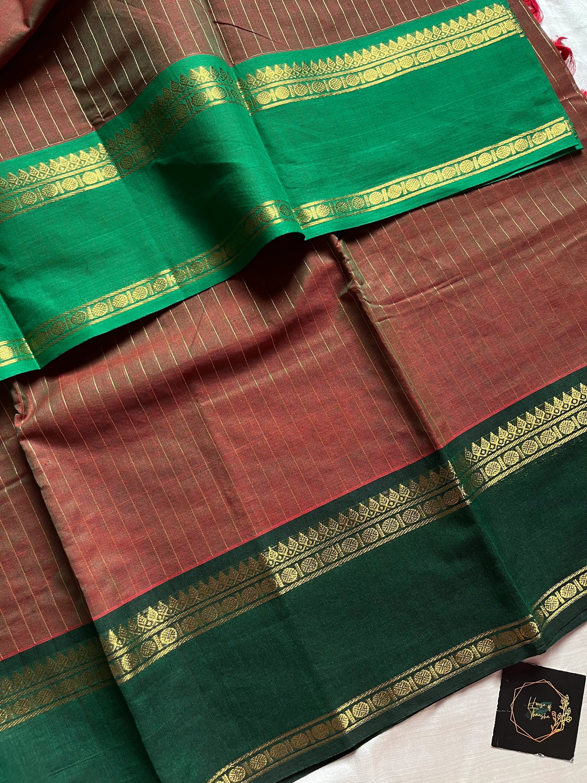 Raw Mango Green Kanchi cotton saree with golden zari stripes and dual green border, vintage handloom festive edition.
