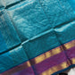 Blue pure Kanchi cotton saree featuring golden zari checks and a grand zari pallu.