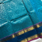 Blue pure Kanchi cotton saree featuring golden zari checks and a grand zari pallu.