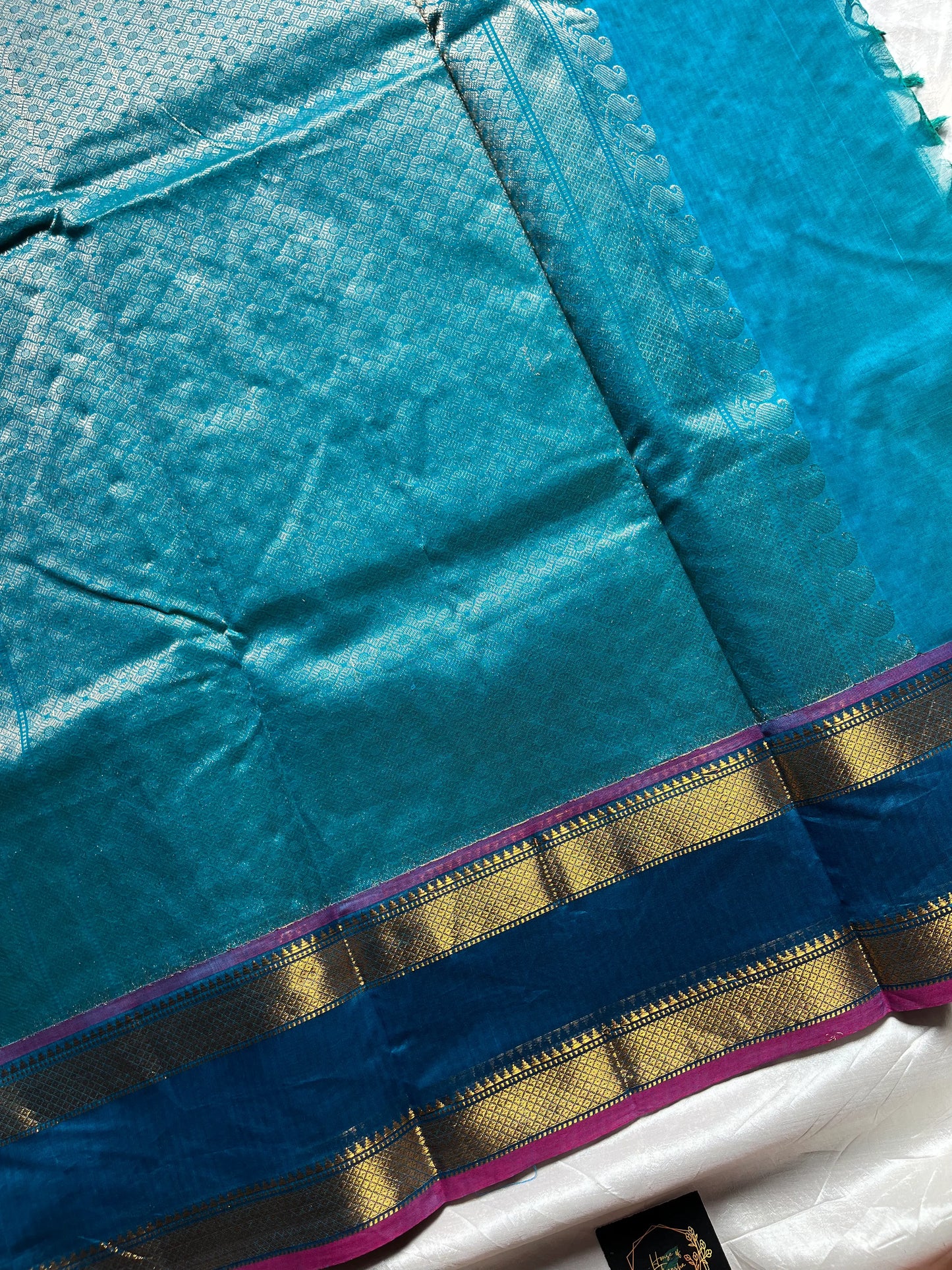 Blue pure Kanchi cotton saree featuring golden zari checks and a grand zari pallu.