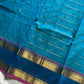Blue pure Kanchi cotton saree featuring golden zari checks and a grand zari pallu.