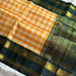 Yellow & white checked Kanchi silk cotton Paalum Pazhamum saree with dark green pure zari border and grand pallu – House of Thansha