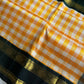 Yellow & white checked Kanchi silk cotton Paalum Pazhamum saree with dark green pure zari border and grand pallu – House of Thansha