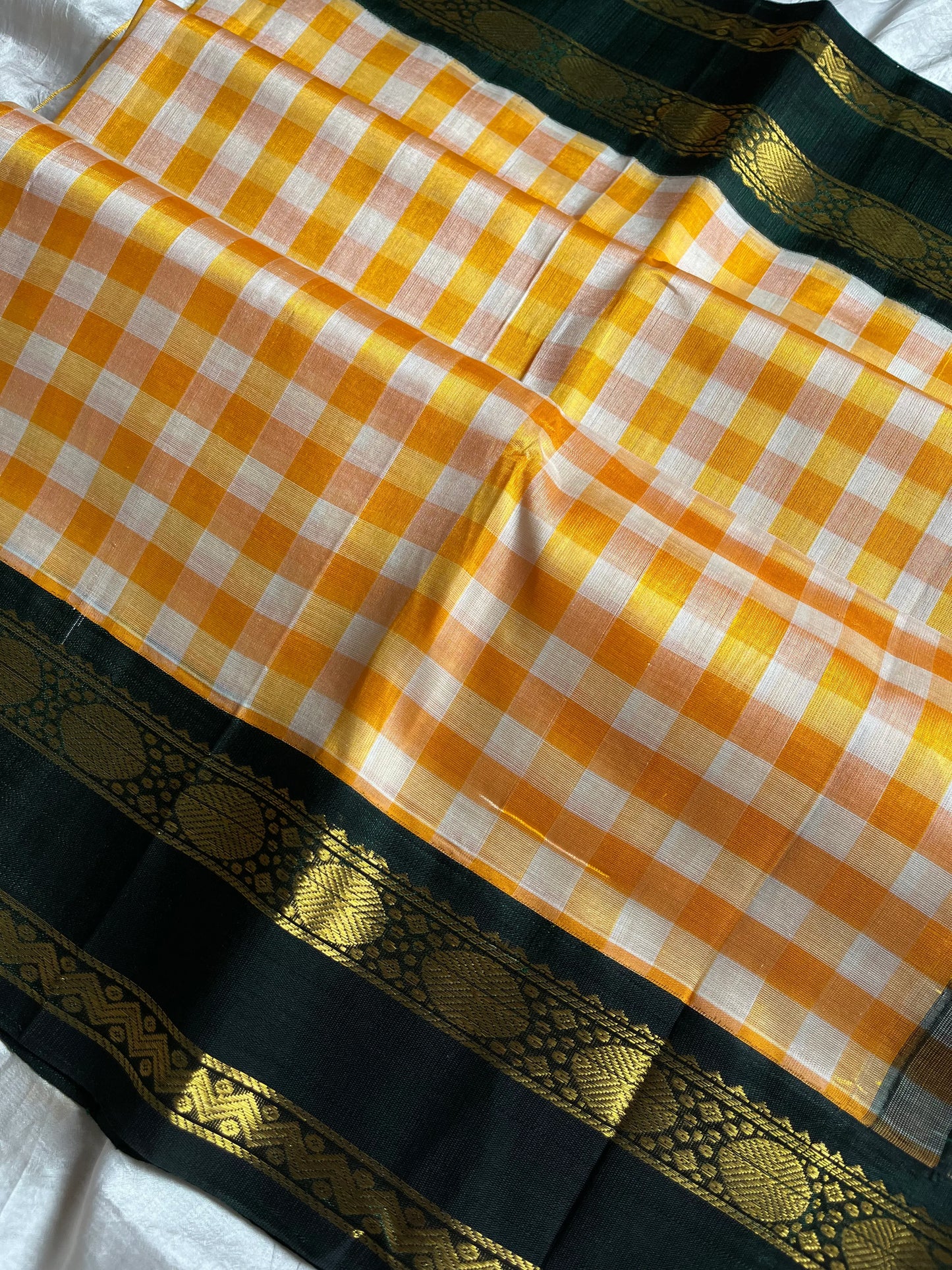 Yellow & white checked Kanchi silk cotton Paalum Pazhamum saree with dark green pure zari border and grand pallu – House of Thansha