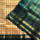 Yellow & white checked Kanchi silk cotton Paalum Pazhamum saree with dark green pure zari border and grand pallu – House of Thansha