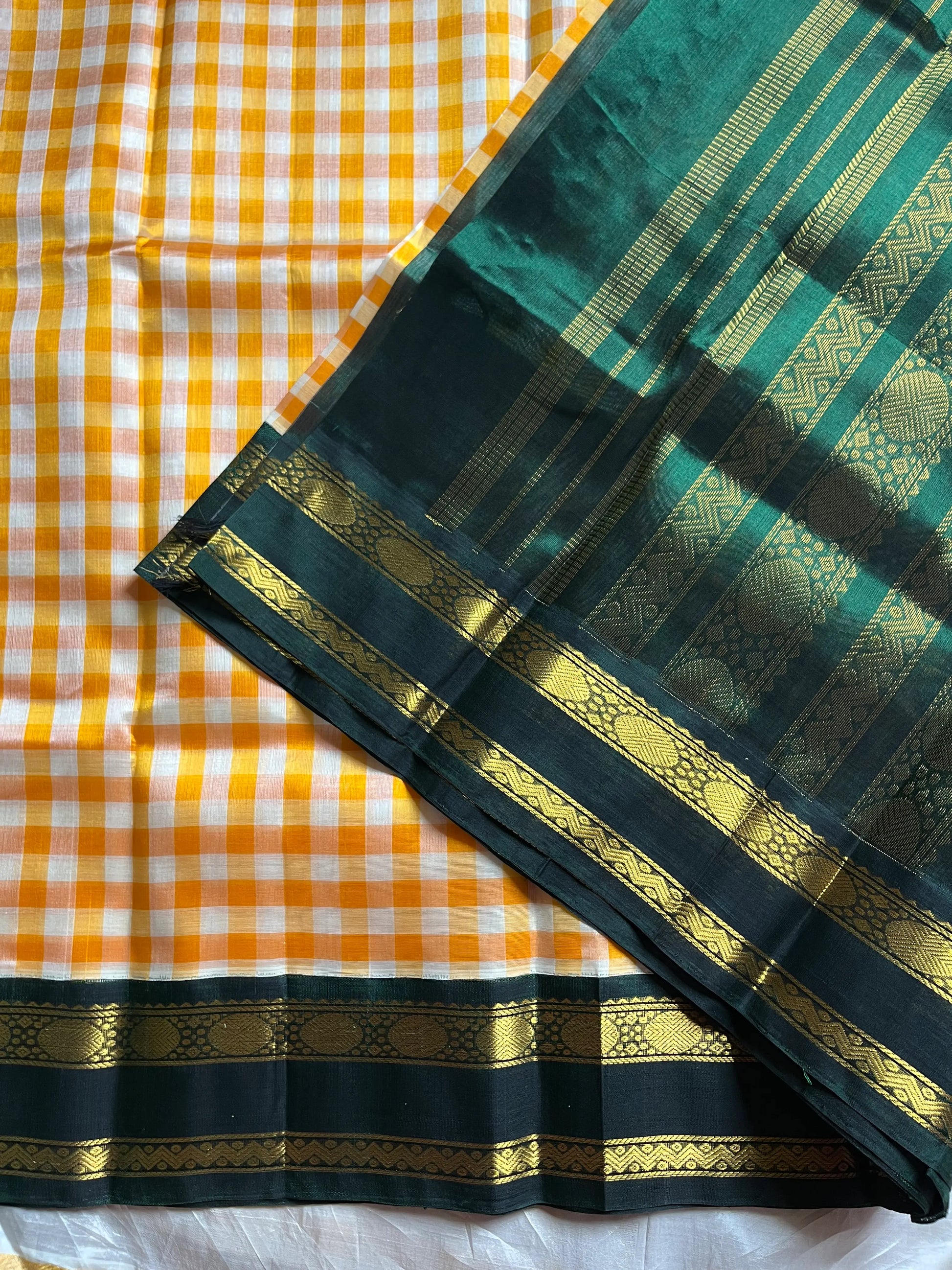 Yellow & white checked Kanchi silk cotton Paalum Pazhamum saree with dark green pure zari border and grand pallu – House of Thansha