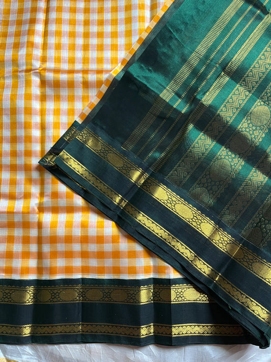 Yellow & white checked Kanchi silk cotton Paalum Pazhamum saree with dark green pure zari border and grand pallu – House of Thansha