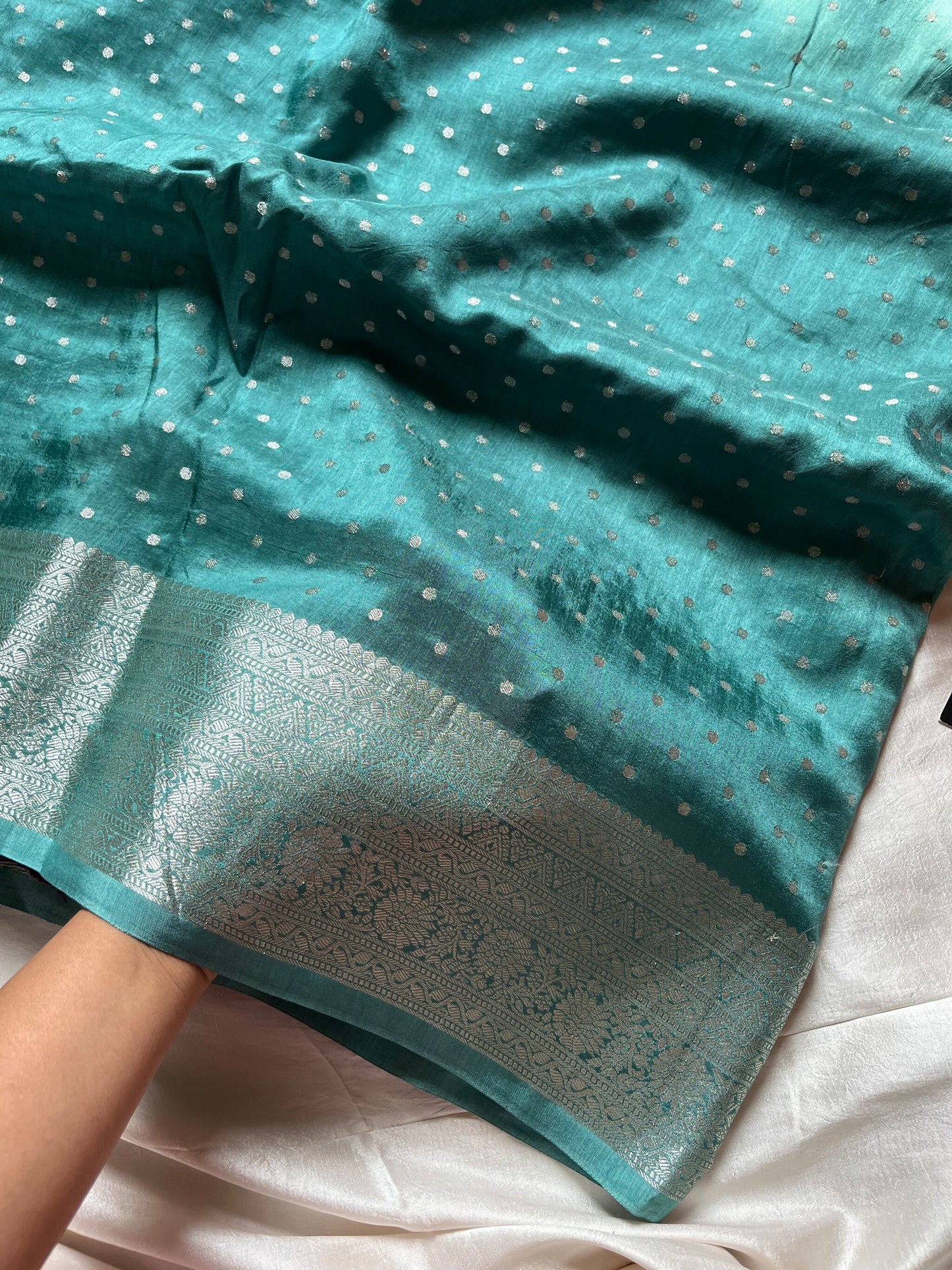 Blue Dola Silk Saree with silver butta, dense pallu, and purple contrast blouse
