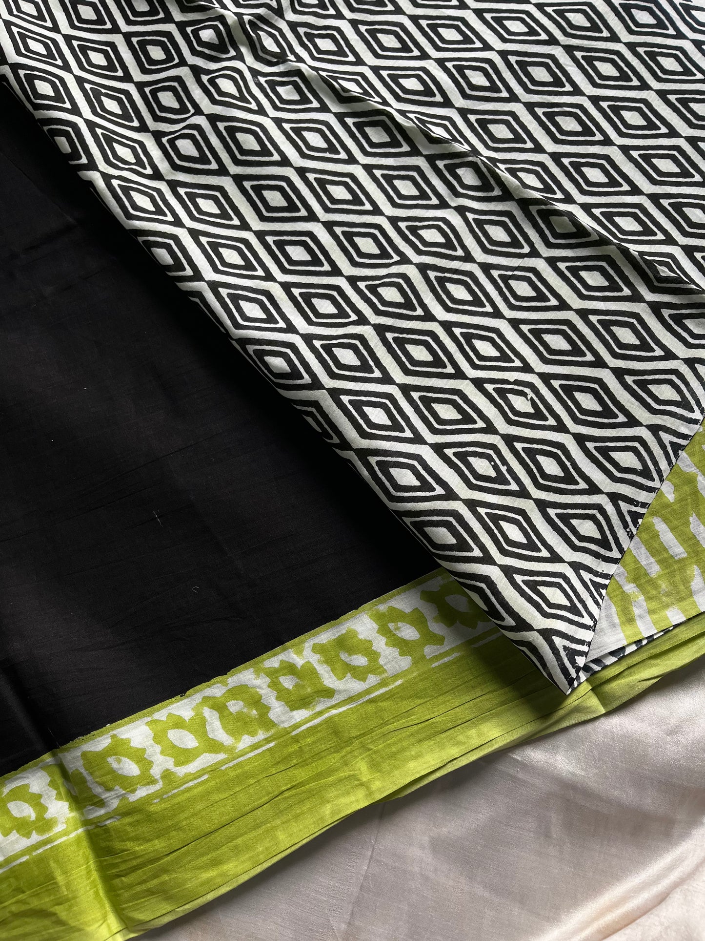 Black mulmul cotton saree with leaf green handblock border and contrast blouse – House of Thansha