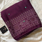 Wine chiffon saree with Bandhani design and all-over mirror work, paired with running blouse