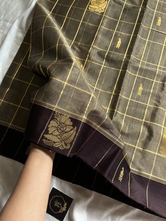 Muted olive brown handloom art silk saree with gold zari checks, coffee brown border, and plum pallu