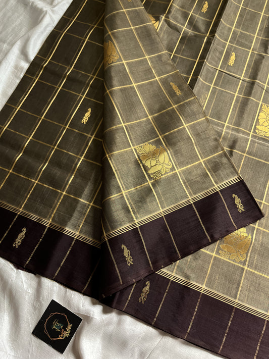 Muted olive brown handloom art silk saree with gold zari checks, coffee brown border, and plum pallu