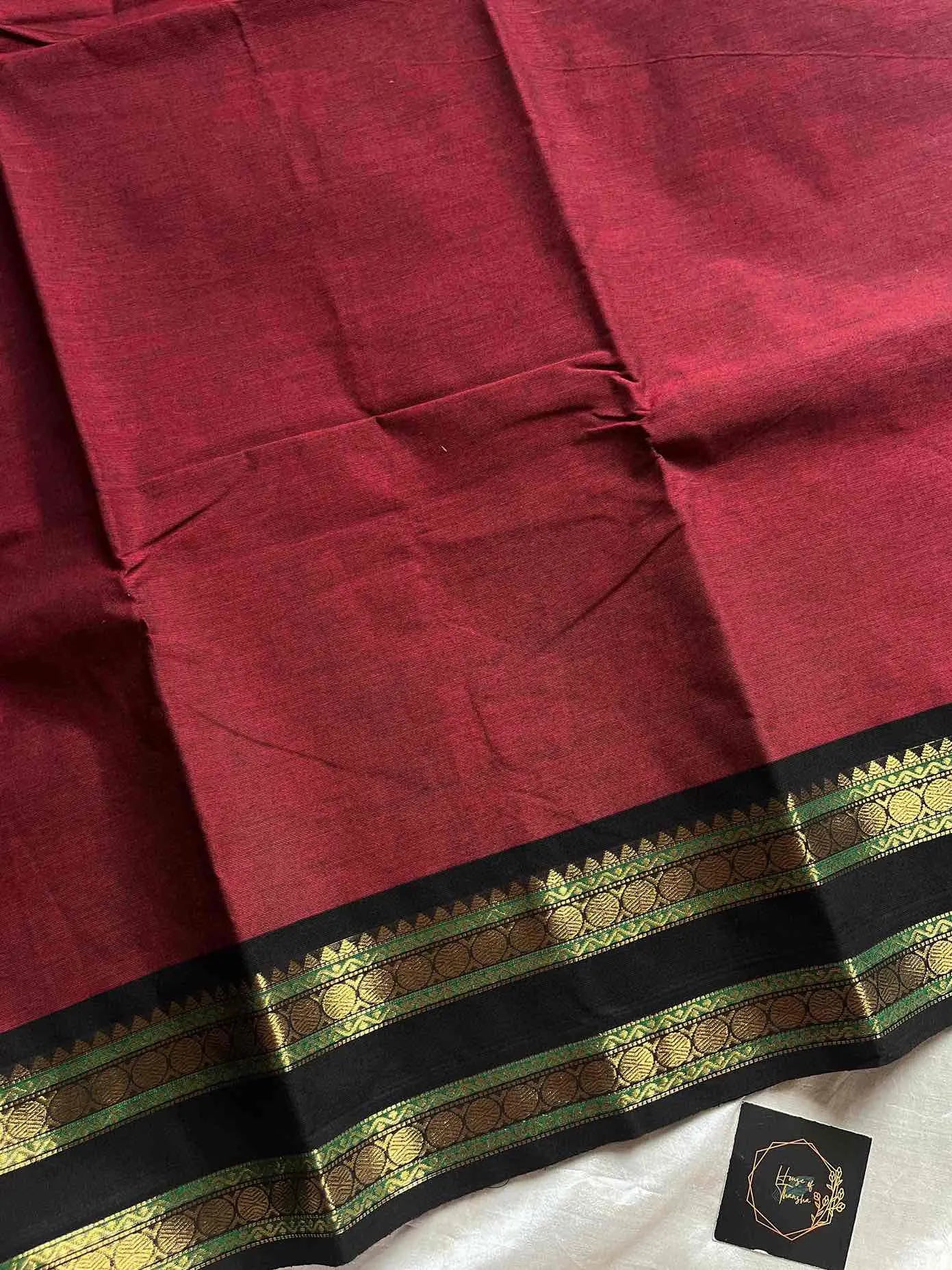 Maroon Kanchi cotton saree with subtle black border