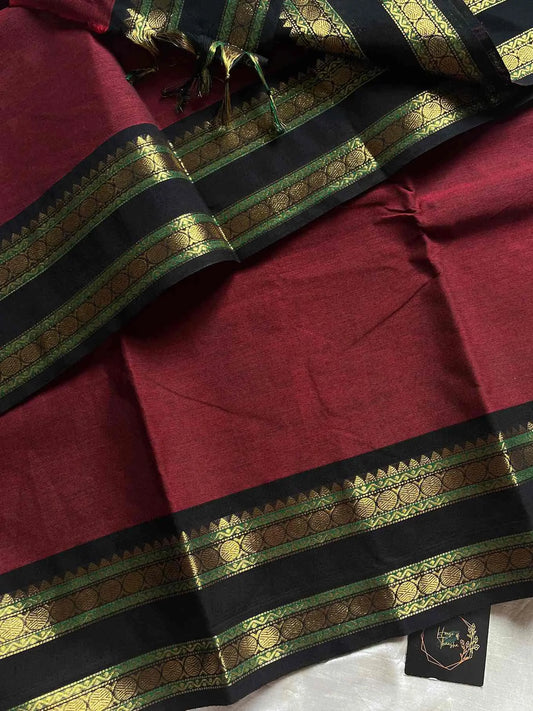 Maroon Kanchi cotton saree with subtle black golden zari border