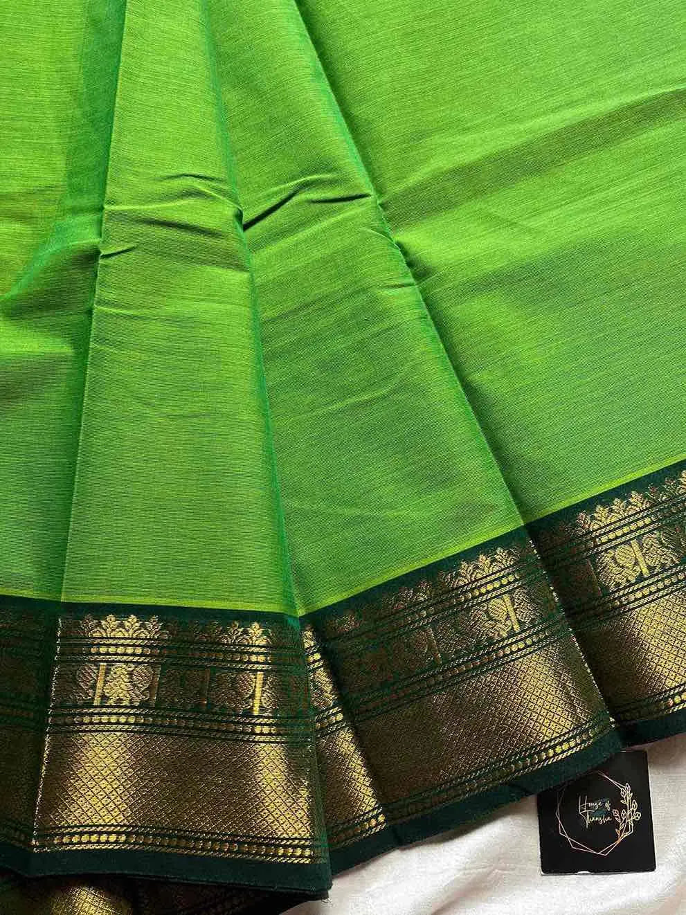 Green Kanchi cotton saree with subtle golden zari border