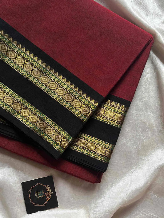 Maroon Kanchi cotton saree with subtle golden zari border