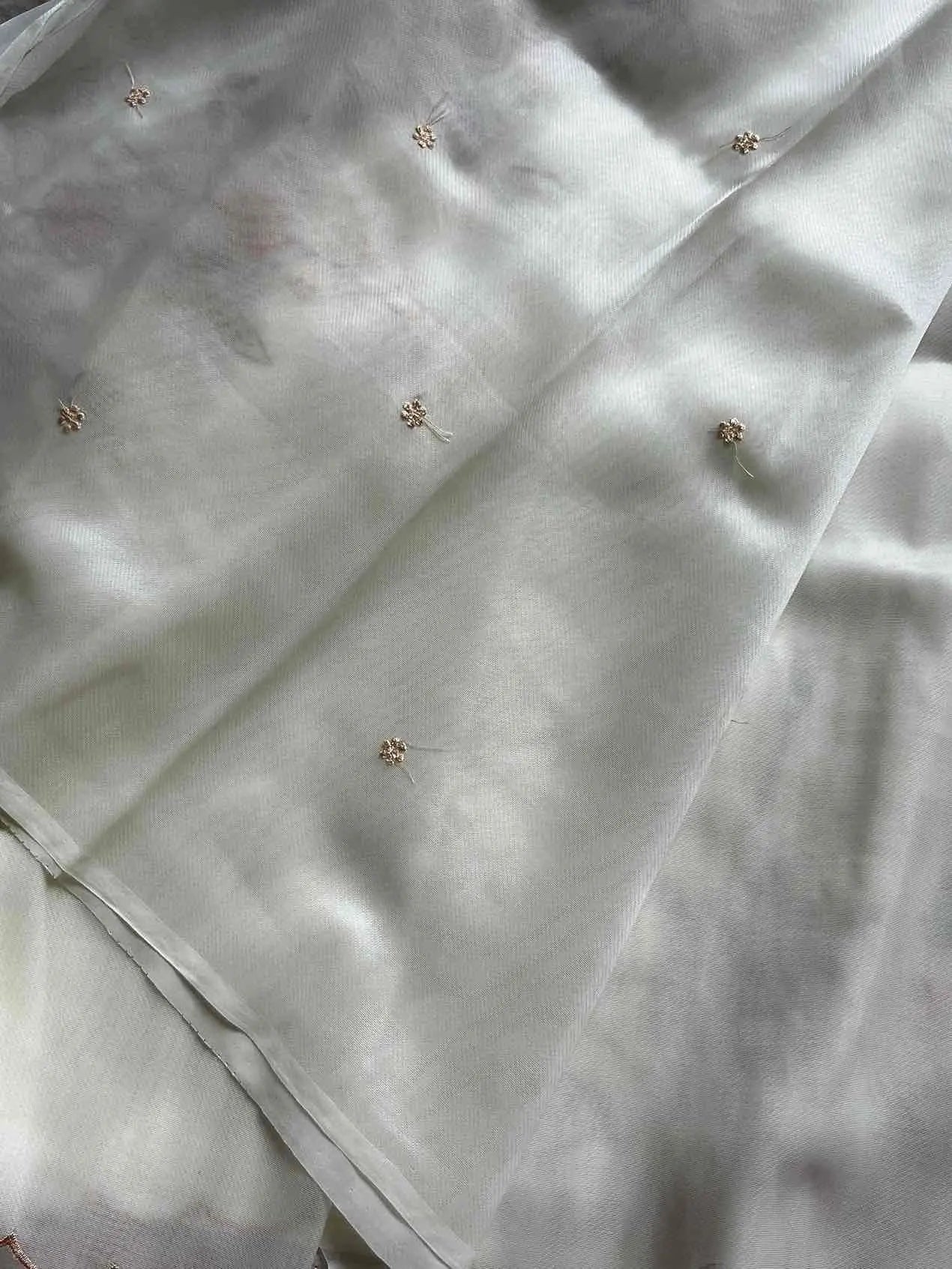 Soft organza saree with floral hand embroidery, flowy non-stiff drape by House of Thansha