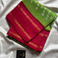 Green Atchu Kattu Sungudi cotton saree with pink border