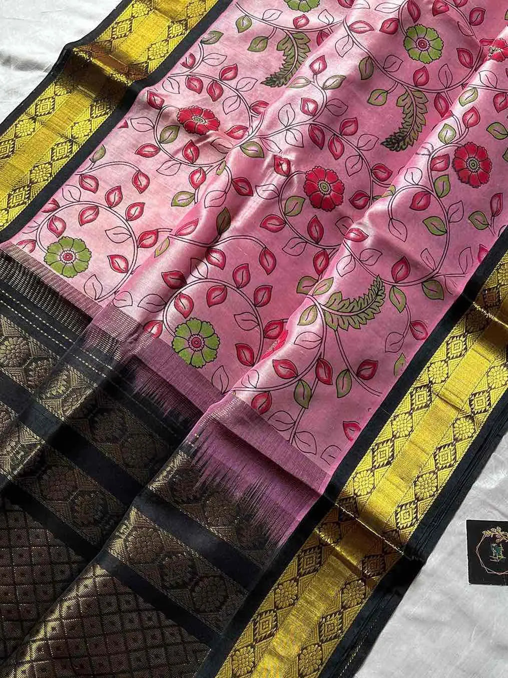 Pastel pink Kanchi silk cotton saree with black border and floral patterns – House of Thansha