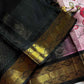 Pastel pink Kanchi silk cotton saree with black border and floral patterns – House of Thansha