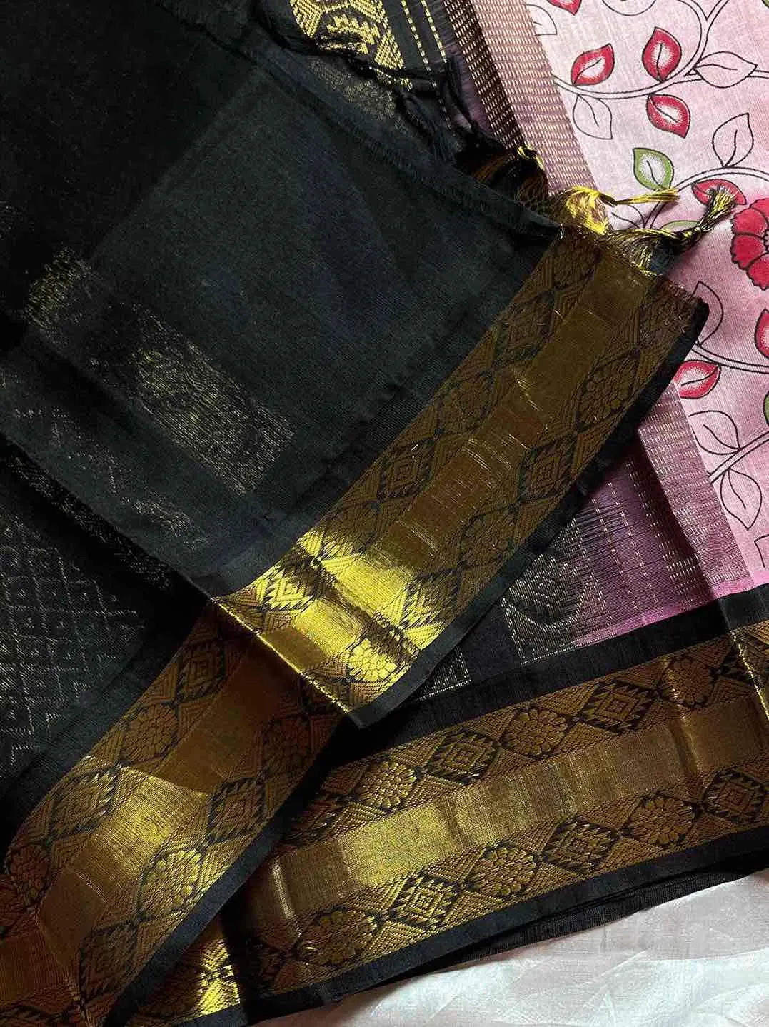 Pastel pink Kanchi silk cotton saree with black border and floral patterns – House of Thansha