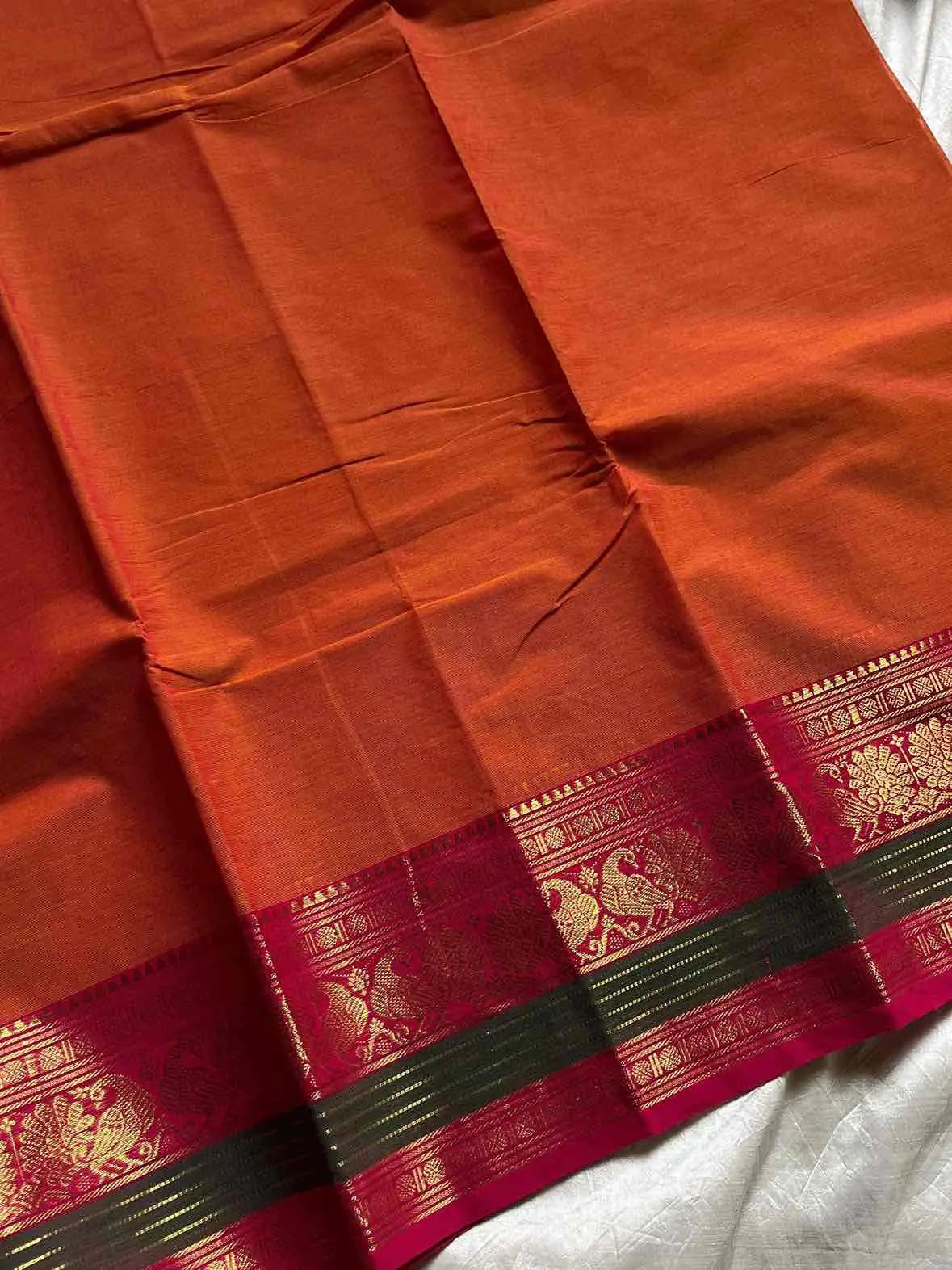 Orange Kanchi cotton saree with subtle golden zari border – House of Thansha