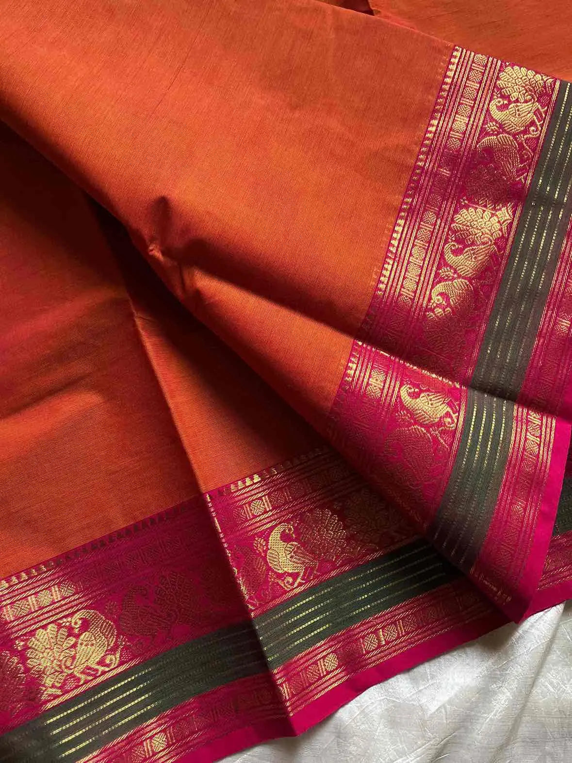 Orange Kanchi cotton saree with subtle golden zari border – House of Thansha